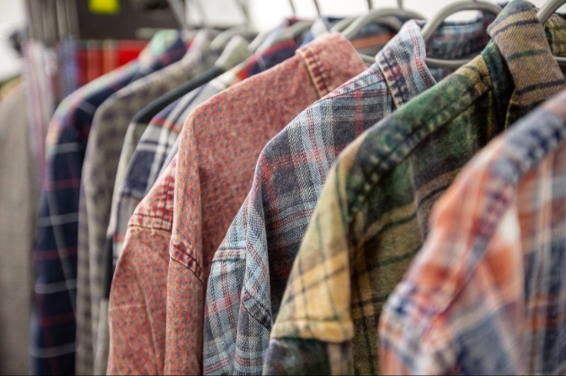 coloured casual shirts on hangers on a rail