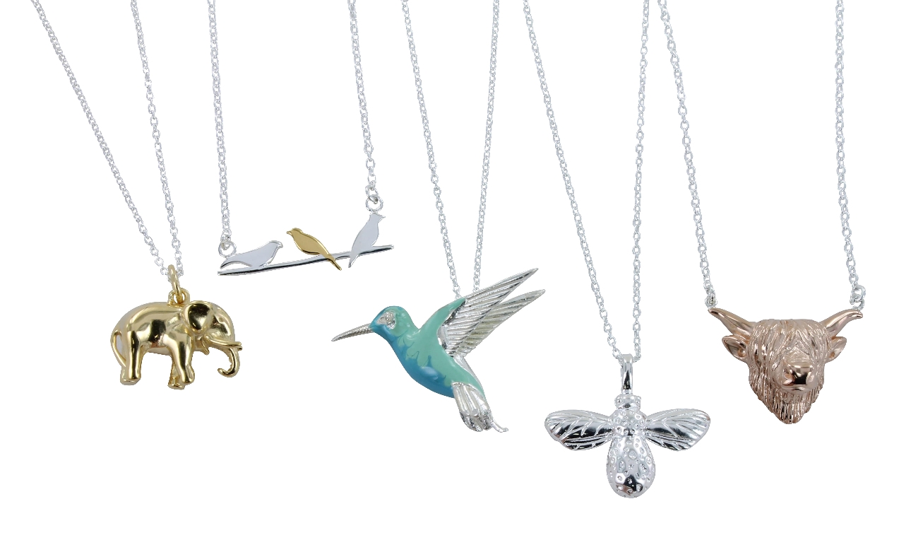 four necklaces all in silver with different animals on them 