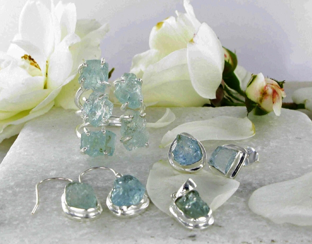 silver rings and earring with aquamarine stones