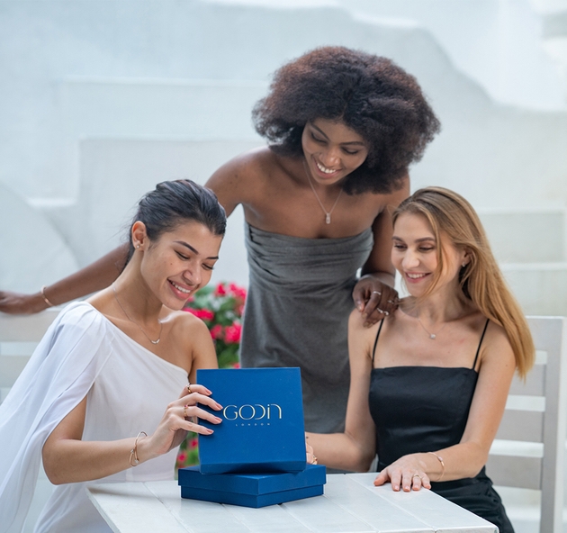 Group of women looking at Godin London jewellery