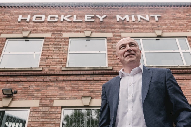 Hockley Mint building with man in suit stood outside