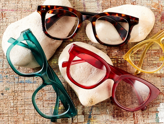 three coloured glasses on a table green red and tortoise shell