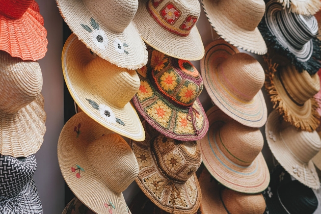 lots of hats on a wall 
