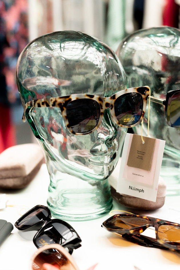 clear mannequin head with sunglasses on