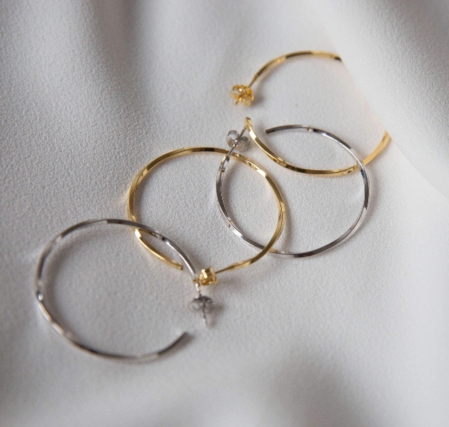 two pairs of thin hoops in silver and gold