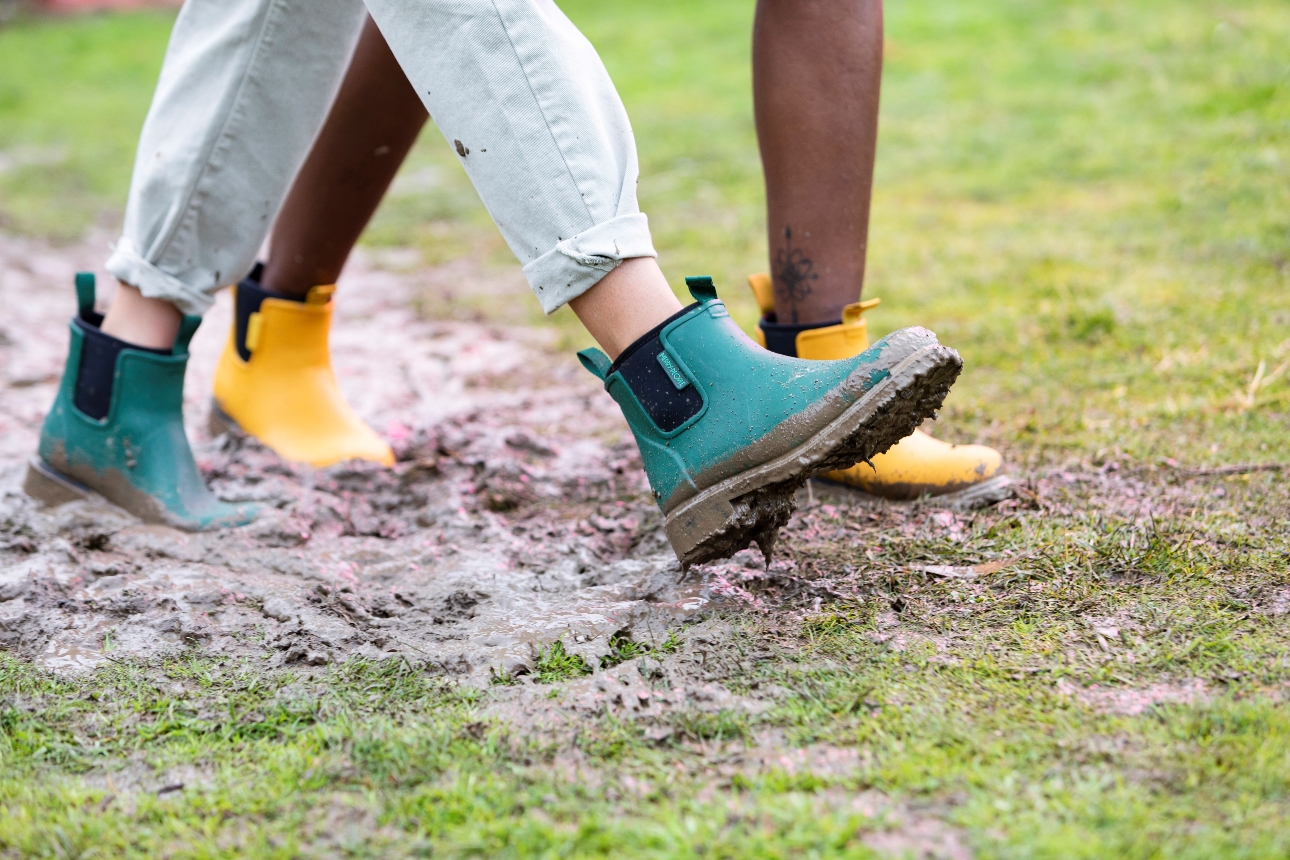 two people in wellies walking in monday