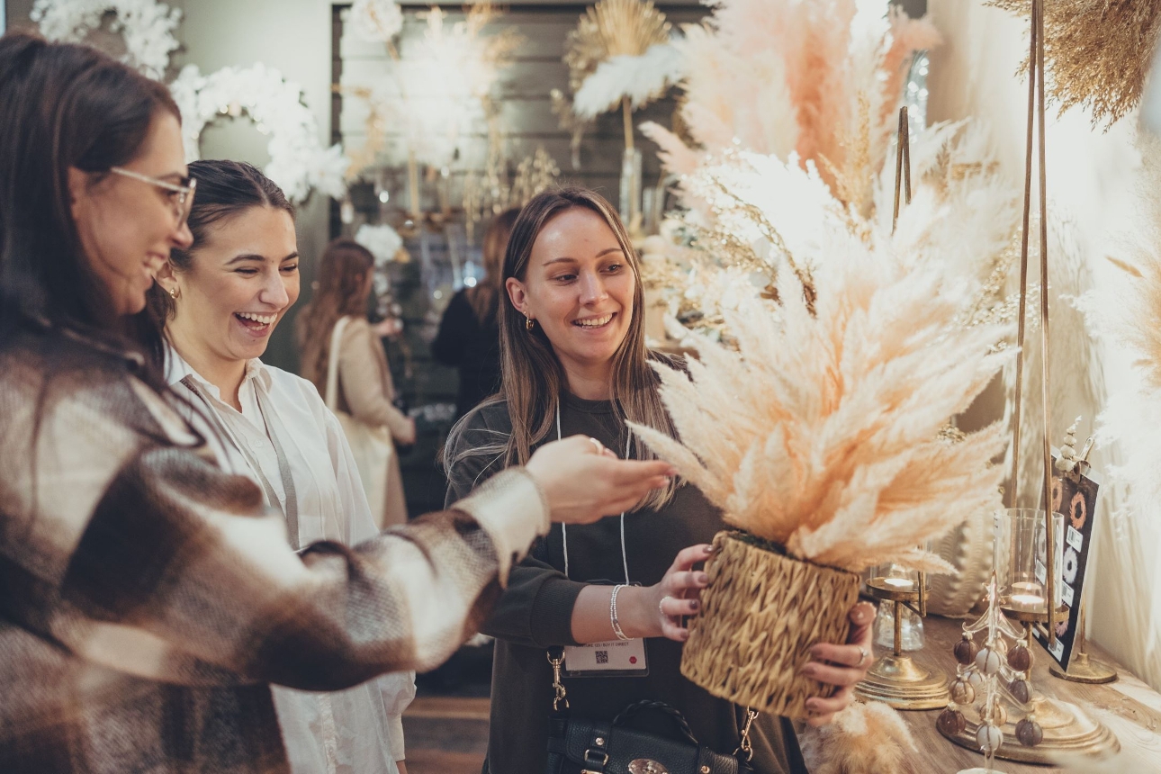 people handling items at show