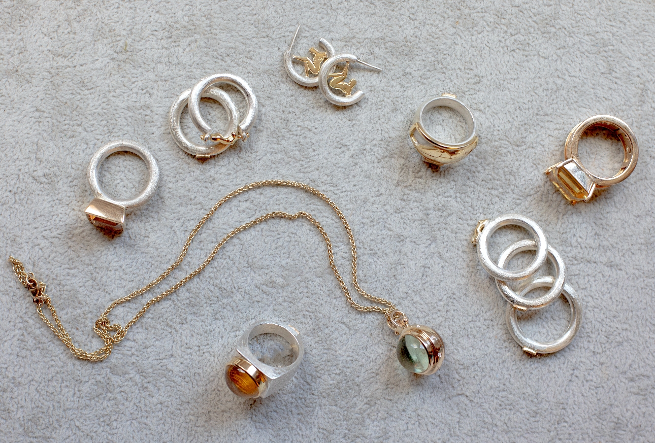 selection of rings and jewellery in gold and silve