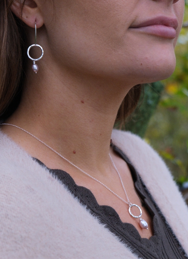woman in silver jewellery, hoops with pearls