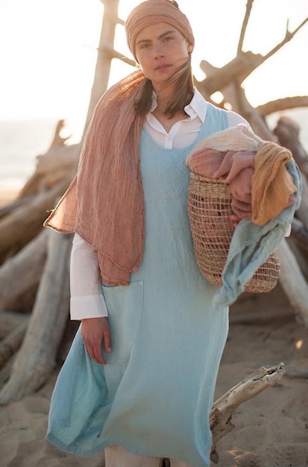 woman in blue linen dress and brown linen headscarf