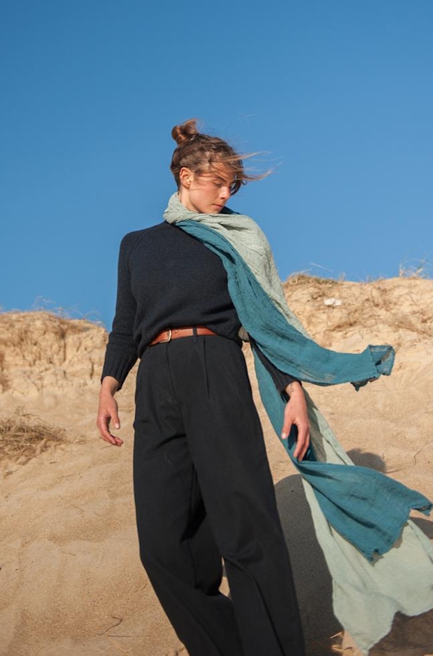woman in black linen top and trousers and blue linen scarves
